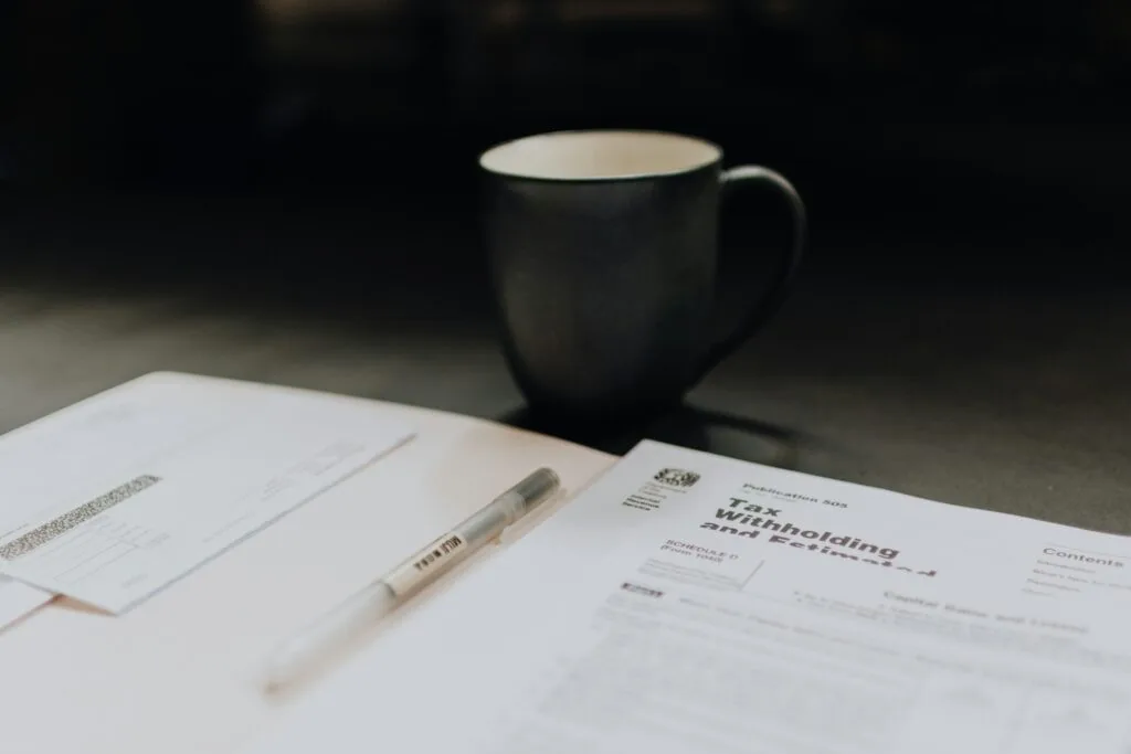 tax papers and coffee cup on a table