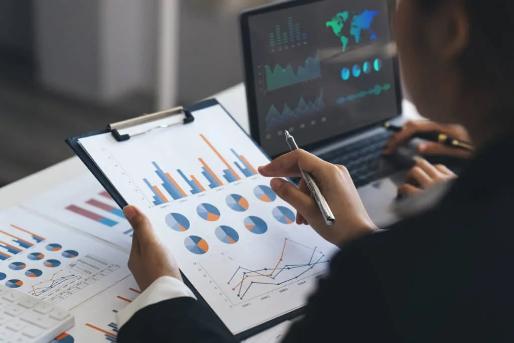 individual analyzing charts and graphs for their startup venture