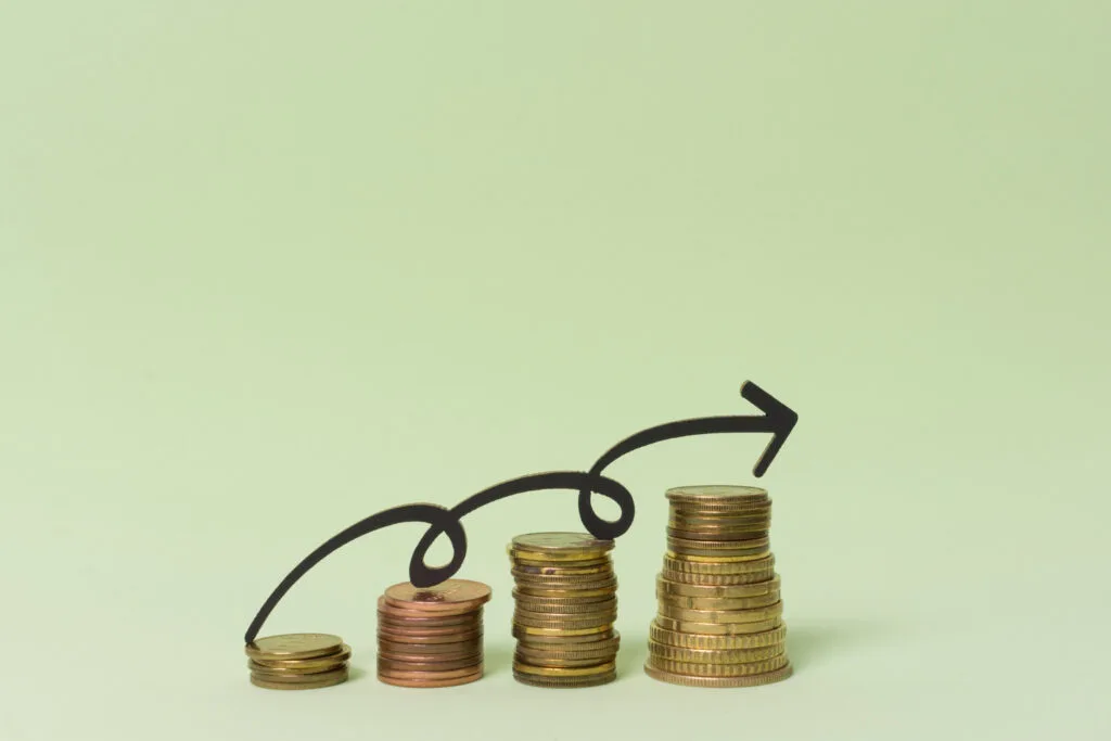 Increasing ROI concept. Coins and arrows.